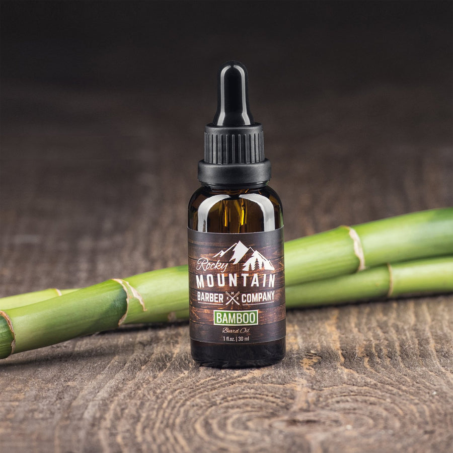 Rocky Mountain Barber Company Bamboo Beard Oil on Wooden Table with Bamboo